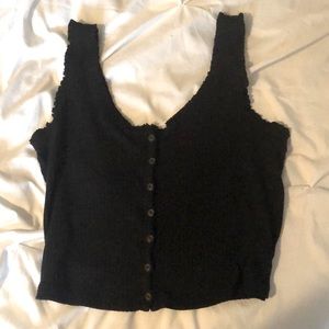 Black tank top with buttons and ruffled sleeves
